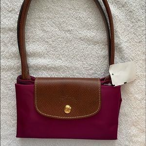 Longchamp Le Pliage dahlia (crimson) tote.